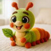 Complete caterpillar crochet kit supplies on wooden table