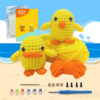 Complete chick and duck crochet plush kit supplies on wooden table