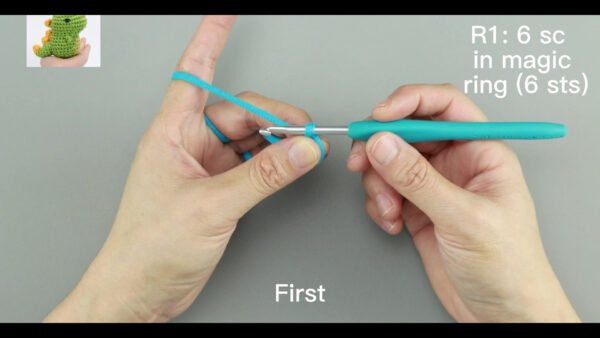 Small crochet brown bear plush placed on a modern office desk