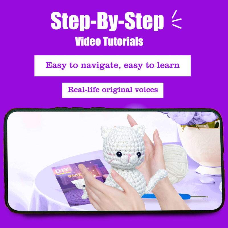 Small crochet white cat plush placed on a modern office desk