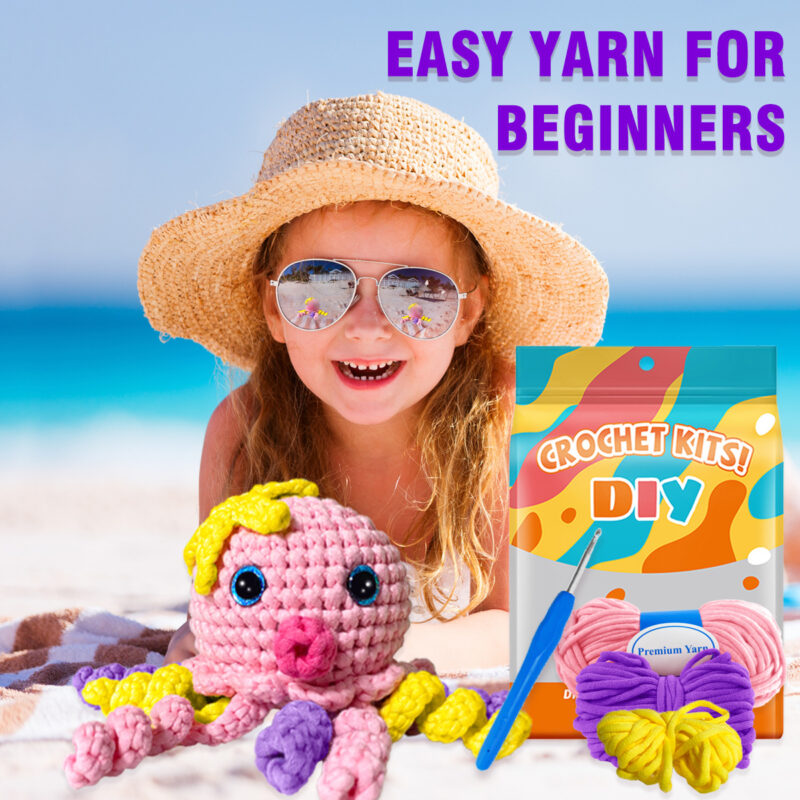 Complete pink octopus crochet plush kit supplies on wooden table