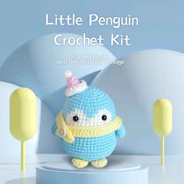 Complete blue christmas penguin crochet plush kit supplies on wooden table