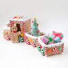 Small crochet candy train placed on modern office desk