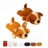 crochet starter kit Two finished handmade dog plushies displayed on a home shelf