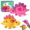 diy dino craft kit Finished handmade green ankylosaurus crochet plush on dinosaur-themed nursery shelf
