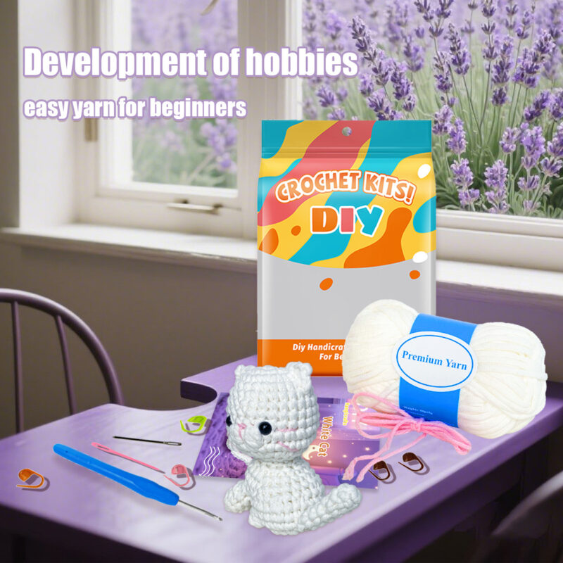 Complete white cat crochet plush kit supplies on wooden table