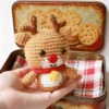 easy crochet project Small crochet christmas plush placed on modern office desk