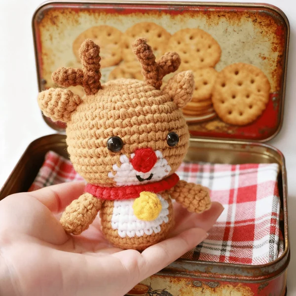easy crochet project Small crochet christmas plush placed on modern office desk