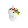 easy crochet project Small crochet unicorn plush placed on a modern office desk