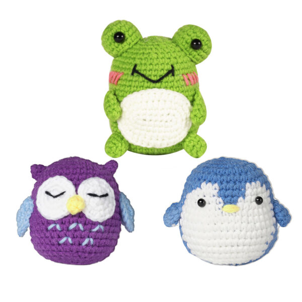 Complete 3 tiny owl crochet plush kit supplies on wooden table