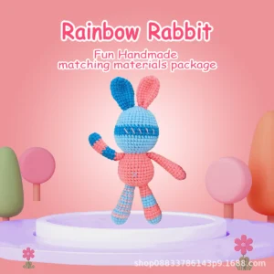 gray bunny with carrot crochet kit Complete gray bunny with tiny carrot crochet kit supplies on wooden table