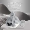 gray shark crochet kit Complete gray shark crochet plush kit supplies on wooden table