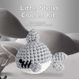 gray shark crochet kit Complete gray shark crochet plush kit supplies on wooden table