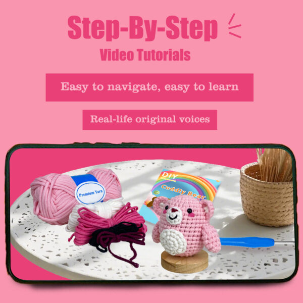 Small crochet pink bear plush placed on a modern office desk