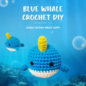 Complete narwhal crochet plush kit supplies on wooden table