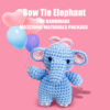 Finished handmade blue elephant crochet plush displayed on nursery shelf