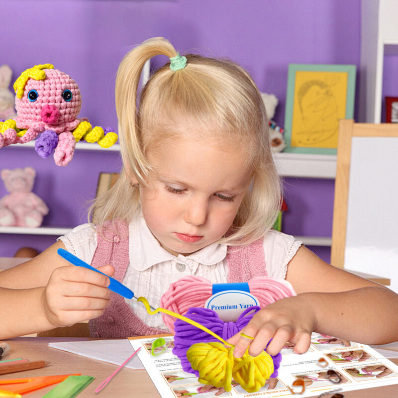 Finished handmade pink octopus crochet plush displayed on shelf