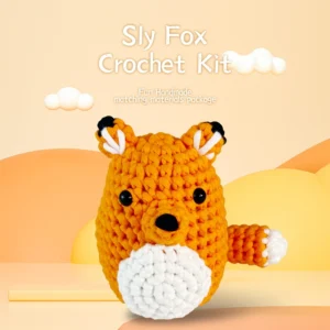 Complete orange fox crochet plush kit supplies on wooden table