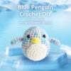 Complete penguin crochet plush kit supplies on wooden table