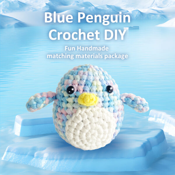 Complete penguin crochet plush kit supplies on wooden table
