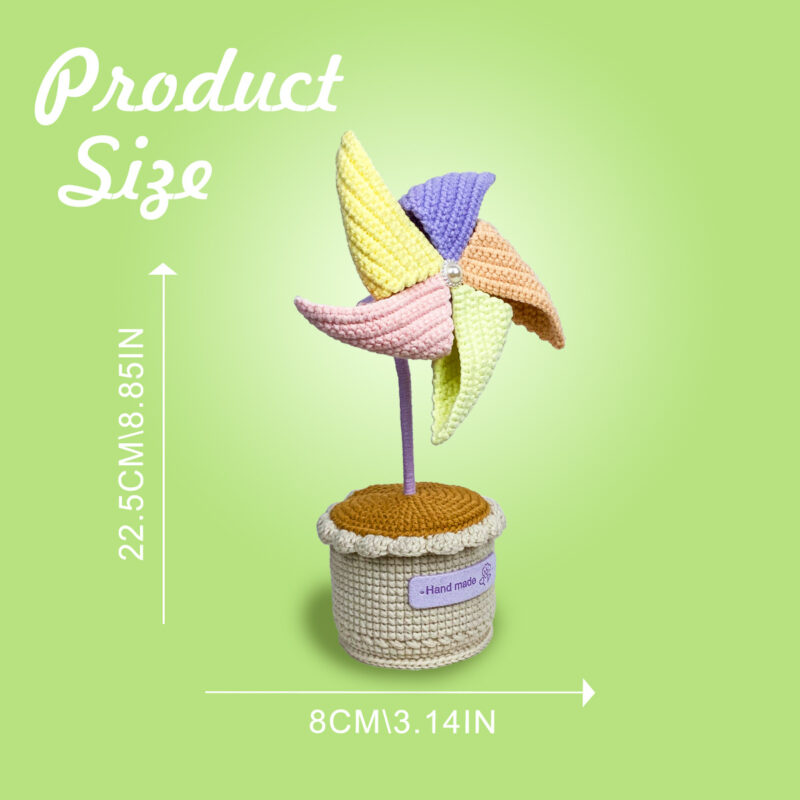 Complete potted pinwheel crochet kit supplies on wooden table