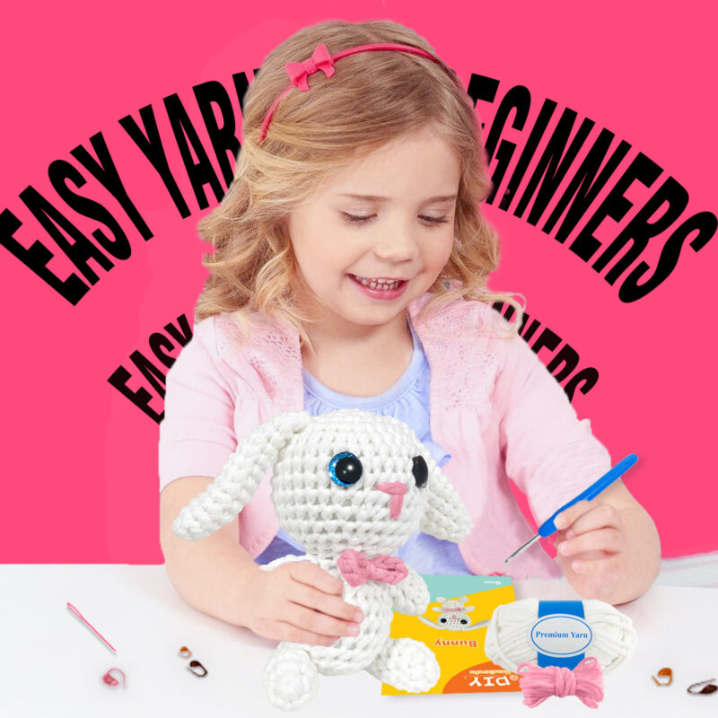 Small crochet tiny white bunny plush placed on a modern office desk