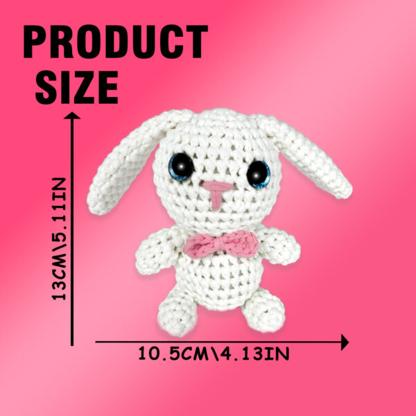quick crochet project Small crochet tiny white bunny plush placed on a modern office desk