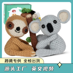 sloth and koala crochet kit Complete sloth and koala 2-pack crochet plush kit supplies laid out on a wooden craft table