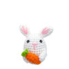 Finished handmade white bunny with carrot crochet plush displayed on shelf