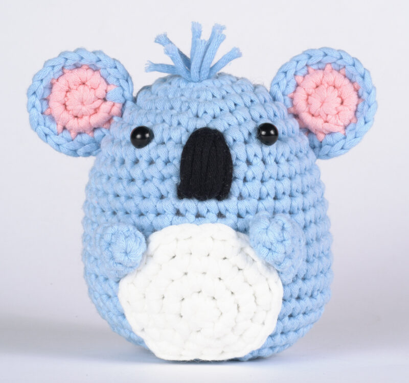 Finished koala with eucalyptus leaf crochet doll