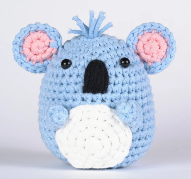 Finished koala with eucalyptus leaf crochet doll