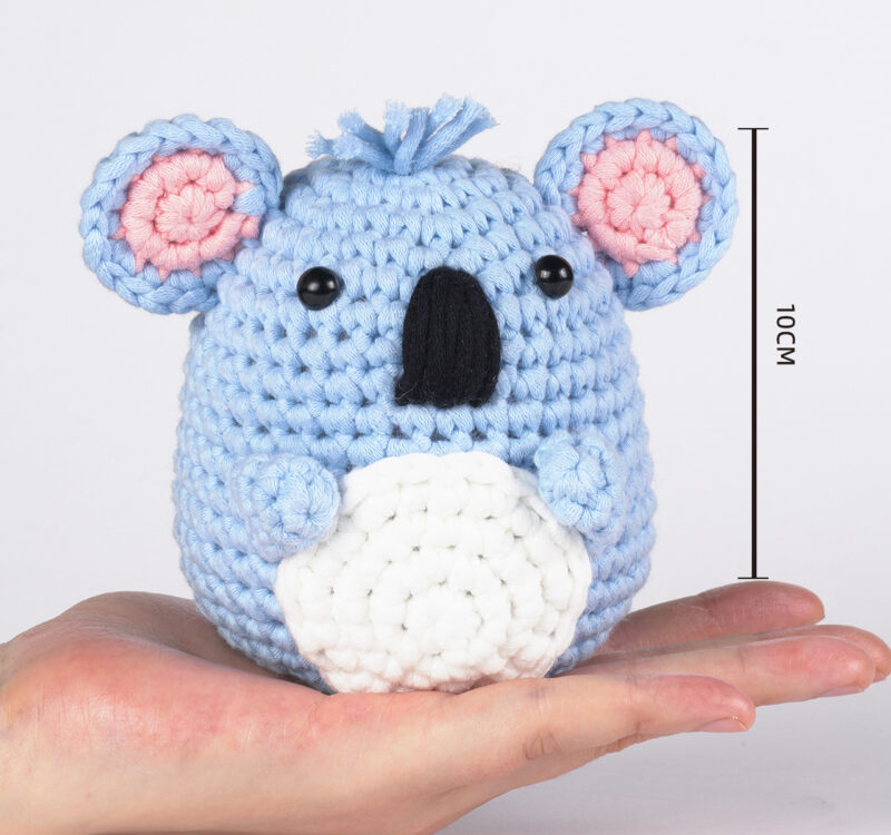 Finished koala with eucalyptus leaf crochet doll